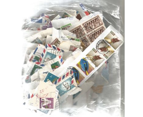 British Commonwealth stamp collection accumulation of stamps on paper in bag a lot of the items are more than 50 years old. G