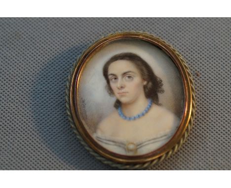18/Early 19th century miniature portrait of a lady (Signed) 7 cm including frame