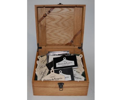 A quantity of Quinta do Vesuvio ceramic decanter labels, all annotated for Vintage Port, and in blond oak fitted box