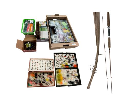 Two boxes of assorted fly fishing flies together with can fishing rod and other fishing tackle