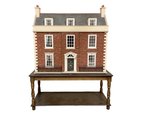 Good quality late 20th century wooden dolls house by M. James dated 1992, as a 19th century style three-storey double fronted