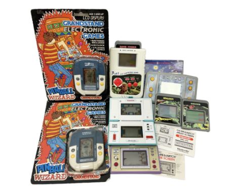 Collection of retro handheld games, including Nintendo Game & Watch 'Snoopy Tennis' (1982) and 'Squish' (1986) both with inst