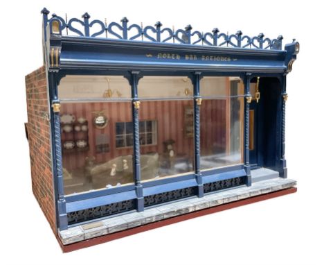 Good quality late 20th century dolls house by M. James dated 1995 in the form of a Beverley East Yorkshire Antique Shop calle