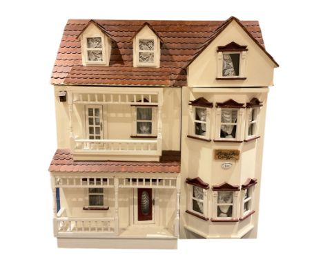 Horse Shoe Cottage - scratch-built wooden doll's house as a three-storey double fronted cottage painted in white and maroon; 