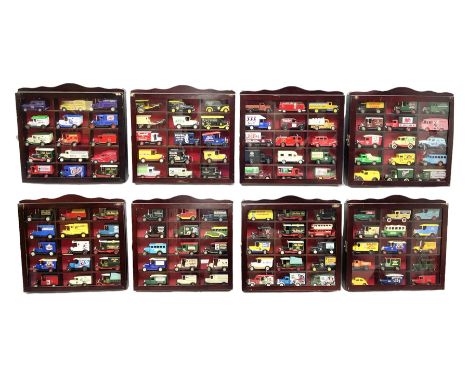 Set of eight wall mounting die-cast model display cabinets, each with hinged glazed door and containing fifteen modern promot