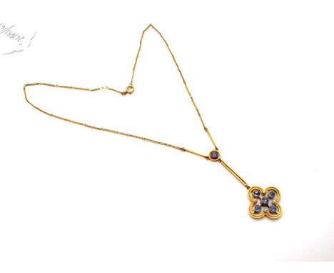An Edwardian Drop Pendant, of openwork design, circular collet set, on bar link chain, stamped “15ct”.