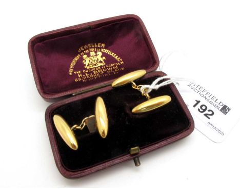 A Pair of Vintage 15ct Gold Cufflinks, on chain connections (5grams), in a fitted case (case incomplete).