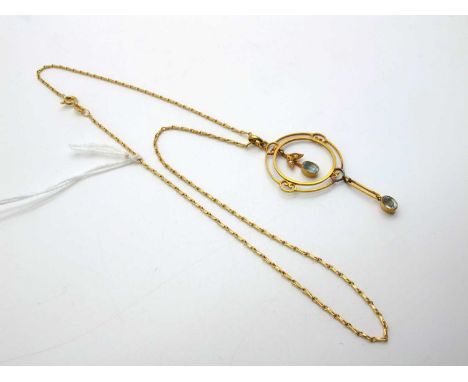 An Edwardian Openwork Drop Pendant, oval collet set, stamped "15ct", on a modern fine fancy link chain stamped "750".