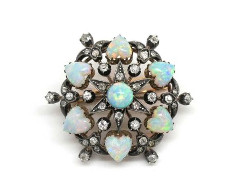 A Victorian Opal and Diamond Set Brooch, of openwork design set with central cabochon and heart shape opals, with old and sin