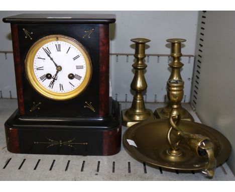 A 19th century black and red marble mantel clock with French striking drum movement; a pair of brass candlesticks and chamber