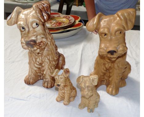 A 1930's pair of large Sylvac Scottie dogs, height 12"; a similar smaller pair, height 5"