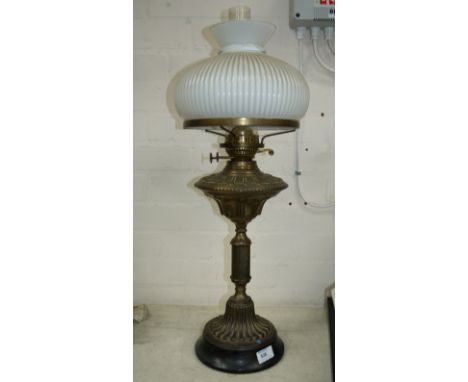A Victorian style brass oil lamp with ribbed white glass mushroom shade, 27"