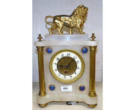A 19th century white marble and gilt metal mantel clock with lion final and French drum movement, height 14"