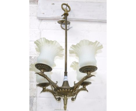 An Edwardian brass 4-branch centre light with folded and frosted shades; a bronzed table lamp; a reproduction rise and fall l