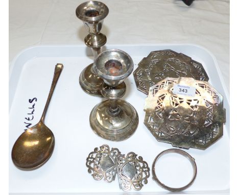A pair of silver candlesticks (a.f.); a silver bangle; a nurse's EPNS buckle; other EPNS