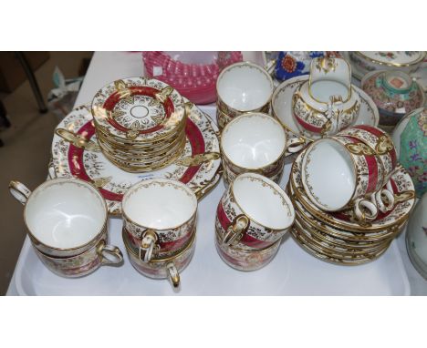 A 19th century red and gilt part tea service, approx 38 pieces