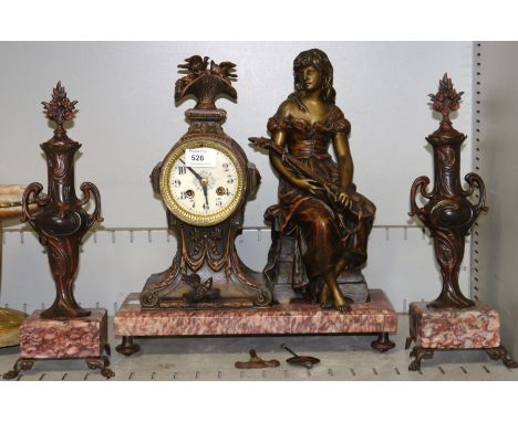 An Art Nouveau style figural mantel clock with side urns, rosso antico marble base