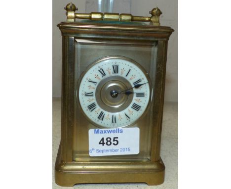 A 19th century brass carriage clock with white enamel chapter ring and 8 day striking movement, height 5½"