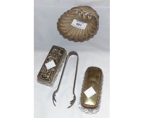 A hallmarked silver shell dish, London 1902; 2 silver top trinket boxes; a pair of silver plated sugar tongs