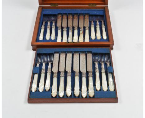 A set of twelve mother of pearl handled fruit knives and forks in original mahogany presentation box