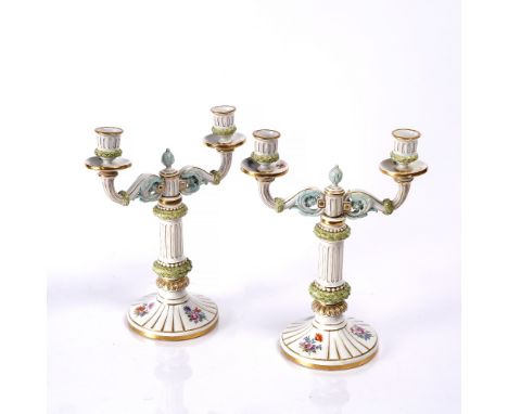 A pair of Meissen column candle sticks 19th Century, blue underglazed crossed swords mark, 26cm high
