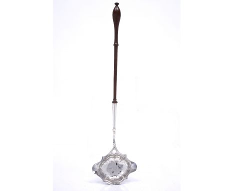 A Georgian silver toddy ladle with turned mahogany candle and shaped bowl, London 1744