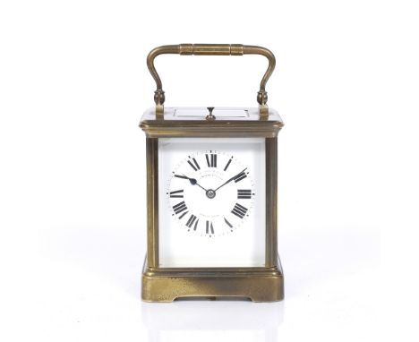 A French brass carriage clock with white enamel Roman dial, replaced platform lever escapement, coiled gong strike and push r