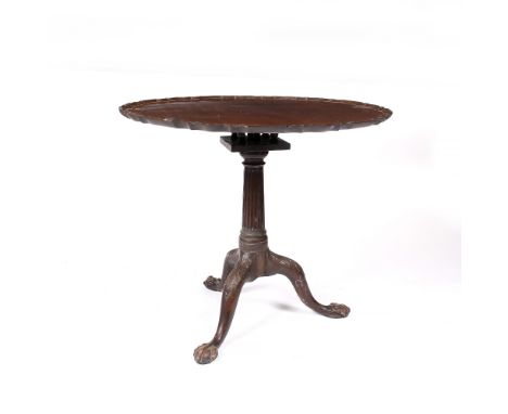 An early 19th Century mahogany tripod table  with single piece piecrust top, in the Chippendale manner, 82cm diameter