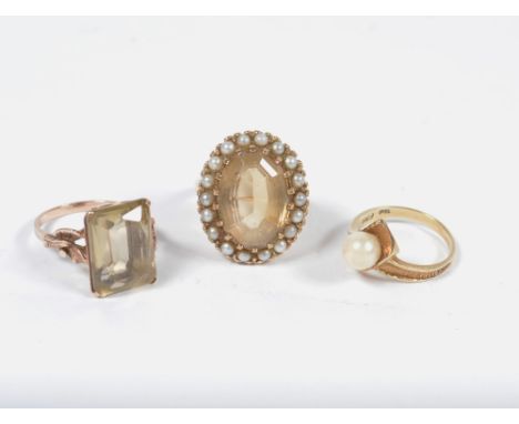 Three various gold rings one with a pearl and citrine setting