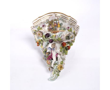 A continental Meissen style wall bracket with fruit and cupid, 28cm 