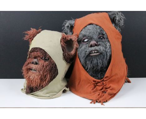 Star Wars - Two Ewok heads / masks made from silicone material with fur exterior with head shawls, with one on display stand,