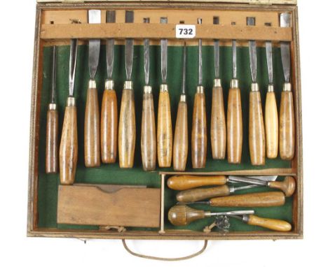A set of 14 ADDIS carving tools and six other tools and a sharpening stone in craftsman made box G+