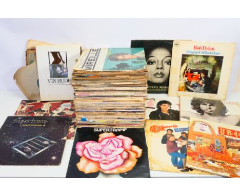 A collection of 12" vinyl records to include Motown, Bob Dylan,, Michael Jackson, The Doors, The Stone Roses, Supertramp, UB4