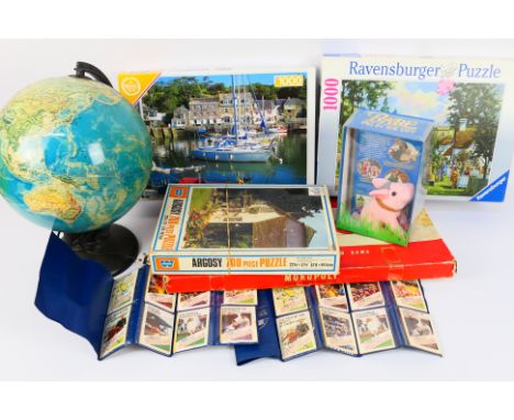 A mixed lot to include a vintage Monopoly by Waddingtons, three Puzzles, a globe and other