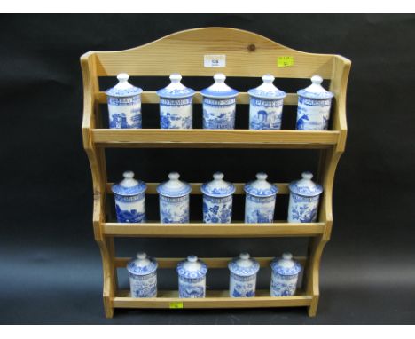 Spode Blue Room collection of spice jars in a pine spice rack