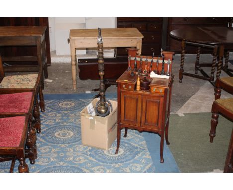 A late 19th/early 20th century mahogany cabinet with pipe stand, raised back above two drawers and cupboard space, 90 cm tall