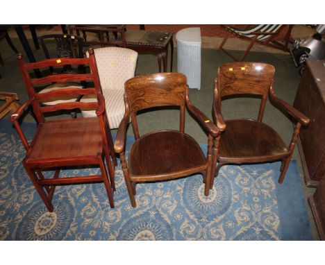 A pair of 20th century low armchairs and stained wood ladder back carver chair 