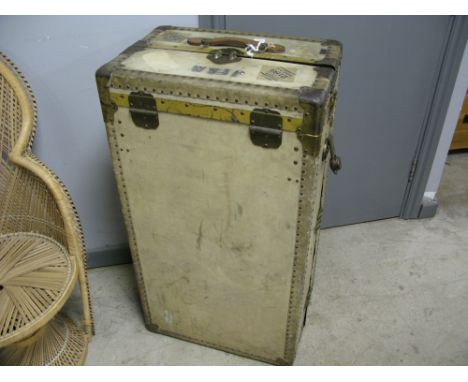 A late 19th/early 20th century travelling trunk with studded corners and JFAM initials to the side by Victor Wardrobe Luggage