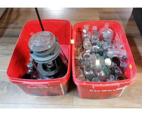 Vintage storm lamp and bottles 