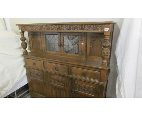 A carved oak buffet sideboard. COLLECT ONLY.