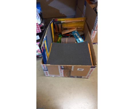A box of tools and wet and dry sandpaper etc