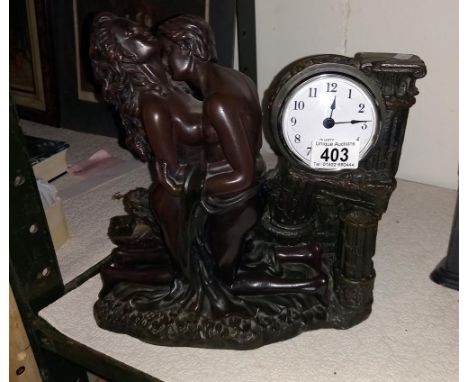 A bronzed resin classical themed mantle clock