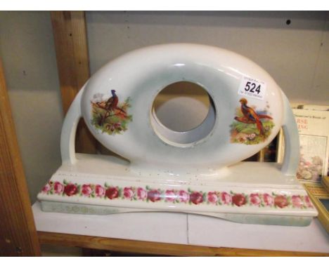 A 1930's pottery clock case