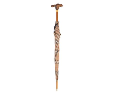 An early 20th Century parasol with carved donkey head automaton handle: the push-button action causing its mouth to open and 