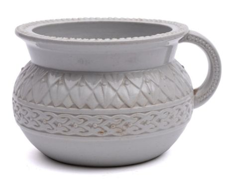 A Belleek (First Period) satirical chamberpot: of typical form the exterior with moulded decoration, the interior transfer de