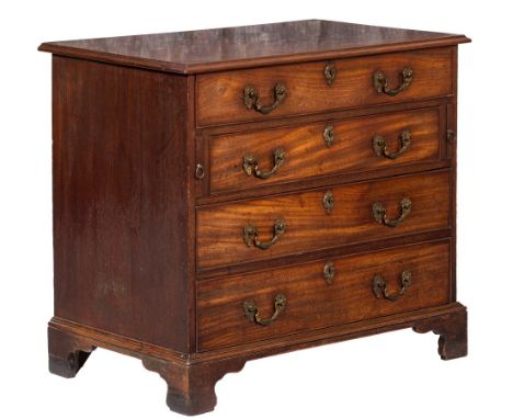 A George III mahogany gentleman's dressing chest: the top with a moulded edge, the frieze drawer with a crimson baize inset s