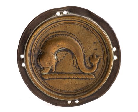 A late 18th Century brass circular cloak badge: depicting a heraldic dolphin, the emblem for Colston School, Bristol, pierced