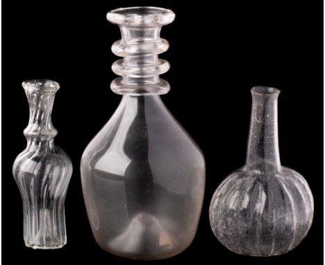 Three pieces of miniature glass: comprising a melon-shaped decanter with raised neck, a wrythen fluted flask and a decanter w