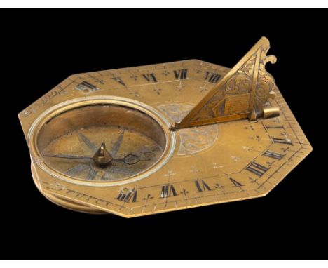 Lefevre, Paris, an 18th century 'Butterfield' type brass pocket sundial: the octagonal dial with hinged gnomon, inset compass