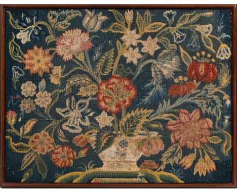 An 18th Century gros-point needlwork panel: worked with a large vase of flowers and foliage, 51 x 66cm in mahogany frame.